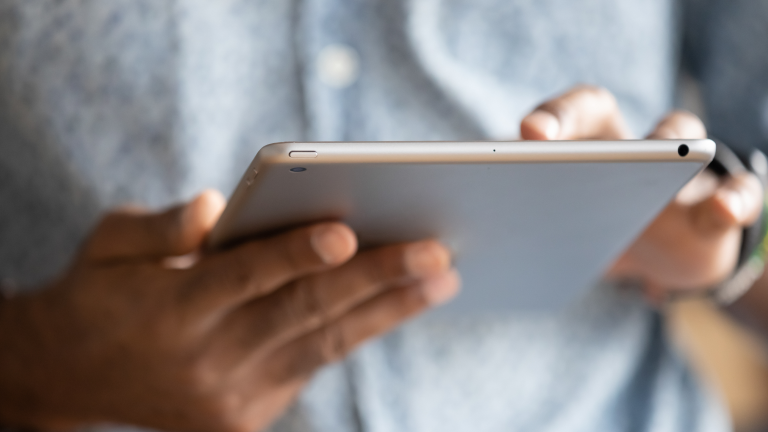 person holding tablet