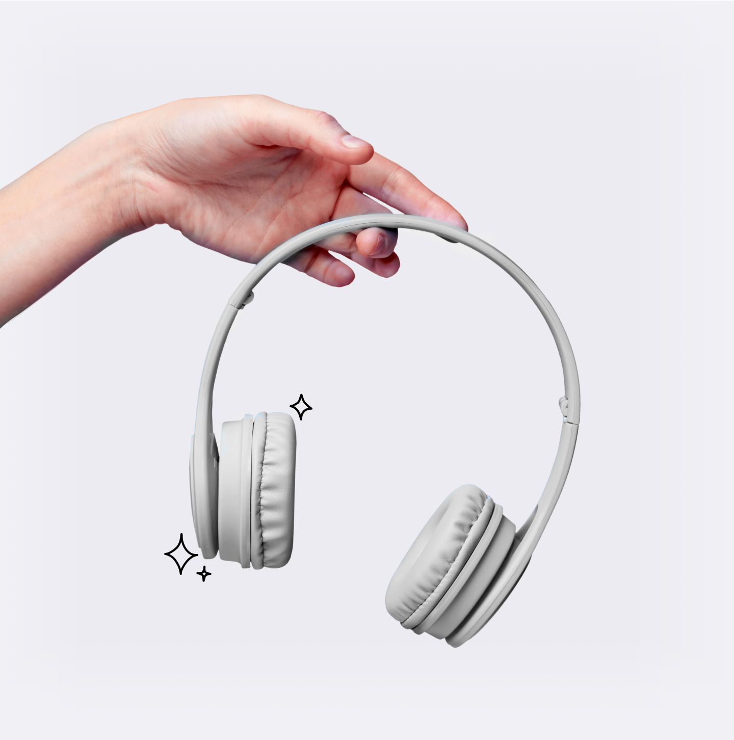Hand holding repaired headphones