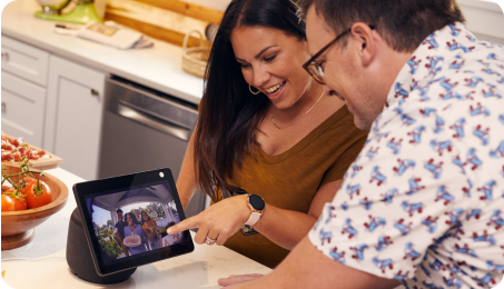 Couple use a tablet to see their front door camera